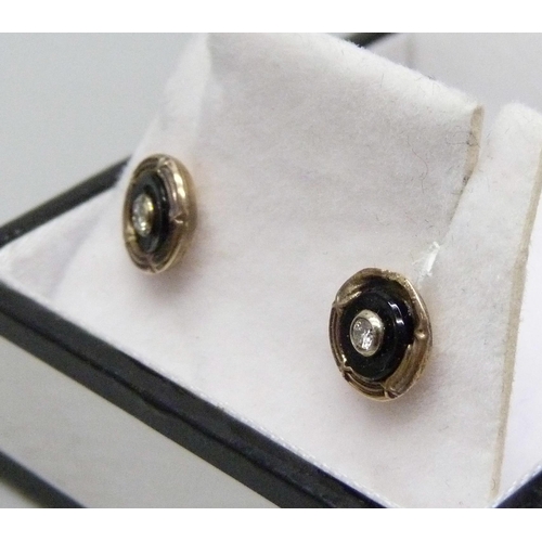 958 - A pair of 9ct gold and diamond stud earrings, 1.2g