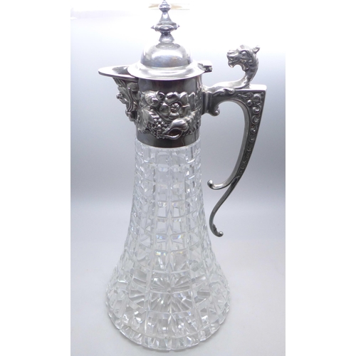 962 - A silver topped claret jug with embossed design, Sheffield 1985, 30cm