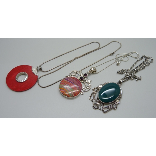 972 - Three silver chains and pendants, 86g