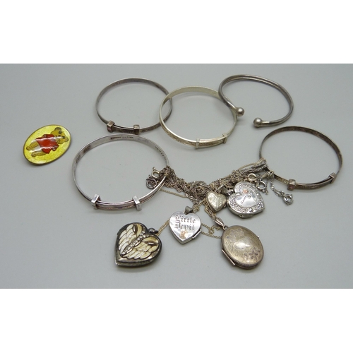 973 - A collection of child's size silver bangles, an enamelled brooch and five silver lockets, 41g