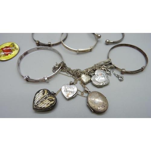 973 - A collection of child's size silver bangles, an enamelled brooch and five silver lockets, 41g