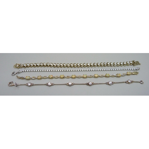 974 - Four silver and gilt stone set bracelets, 32g