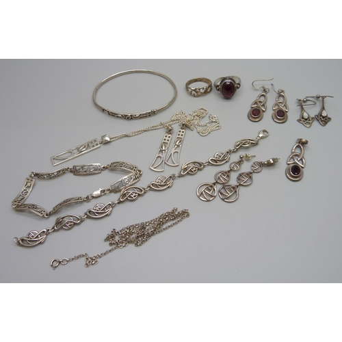 975 - A collection of Celtic style silver jewellery including a bangle and two bracelets, 63g