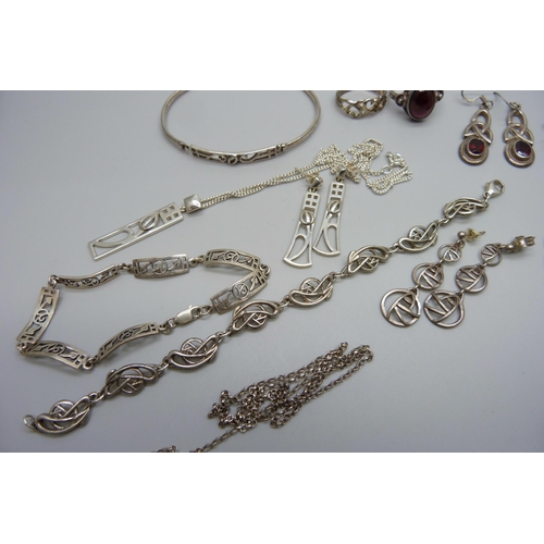 975 - A collection of Celtic style silver jewellery including a bangle and two bracelets, 63g