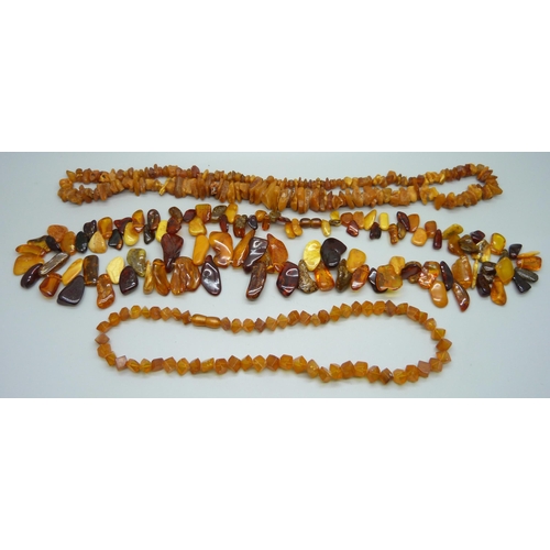 983 - Three amber and amber style necklaces, 130g