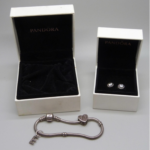 991 - A Pandora bracelet with two charms (one Pandora) and a pair of Pandora earrings, both boxed