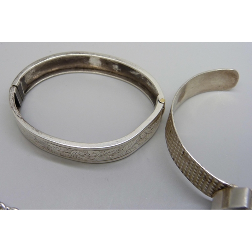 993 - A collection of silver bangles, bracelets and chains, 111g, together with a silver necklace with pla... 