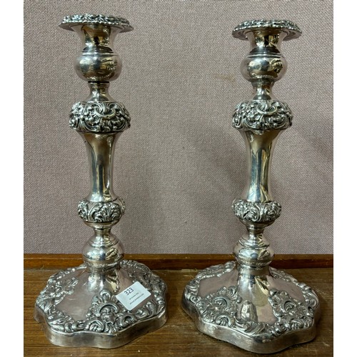 323 - A pair of silver plated candle sticks