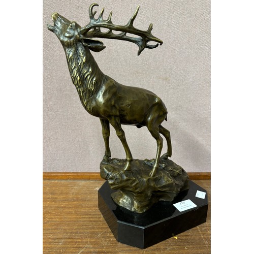 325 - A French style bronze figure of a stag, on black marble socle