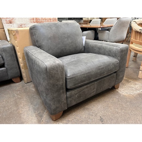 3116 - A Marco armchair in sanded charcoal *This lot is subject to VAT