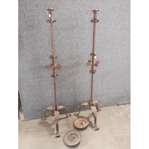 287 - A pair of cast and wrought iron candle stands