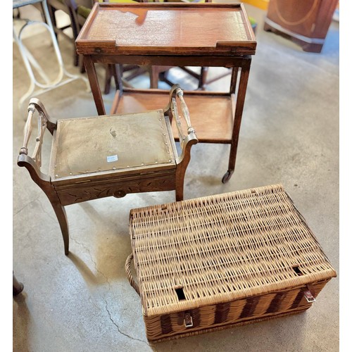 263 - A mahogany piano stool, wicker basket and an oak trolley