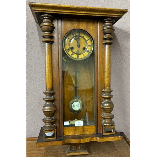 338 - An early 20th Century walnut wall clock