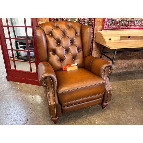 3127 - A Buckingham power reclining wing chair in vintage Tabuc *This lot is subject to VAT