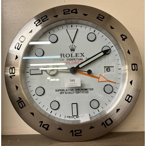 349 - A Rolex style dealers display wall clock