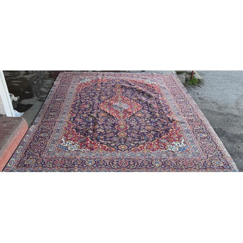 246 - An Iranian blue ground rug (393cm x 287cm)