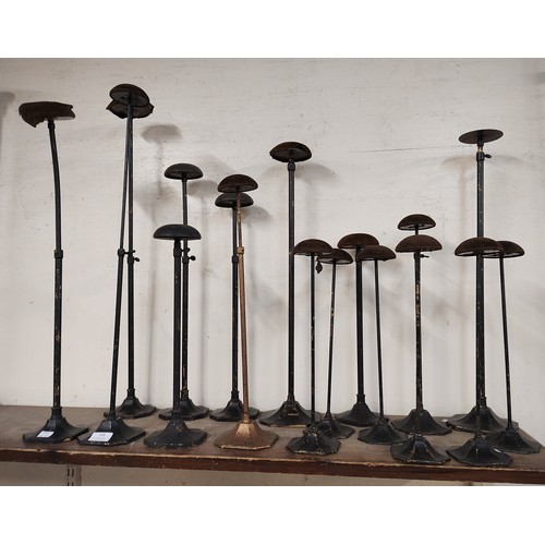 308 - Seventeen early 20th Century metal hat stands