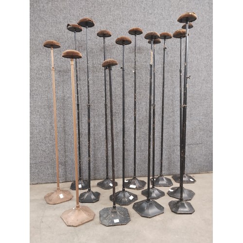 309 - Fourteen early 20th Century metal hat stands