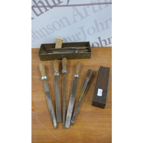 5255 - A box of assorted hand tools including, files, sharpening stone, nails, screws and other consumables