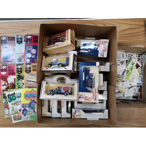 749 - A collection of die-cast vehicles including Days Gone, I-Spy magazines and a box of tea cards