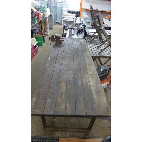 5236A - A 7ft x 2.5ft wooden workshop table with a steel frame and attached record No.74 auto vice