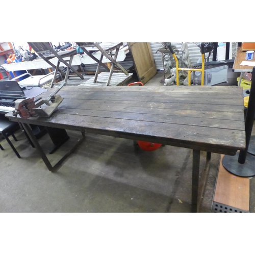 5236A - A 7ft x 2.5ft wooden workshop table with a steel frame and attached record No.74 auto vice