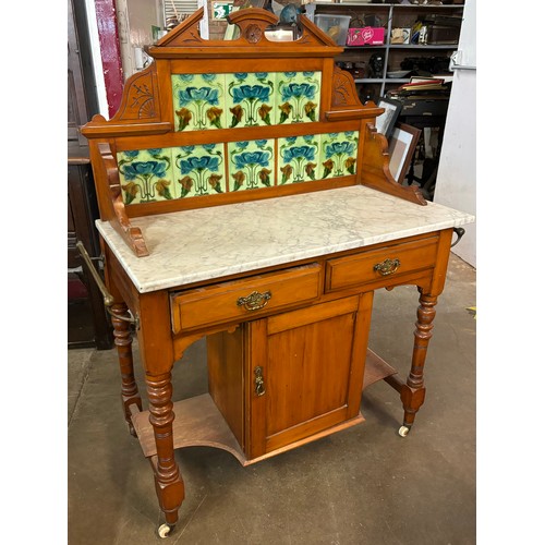 237A - An Art Nouveau pine and marble topped washstand