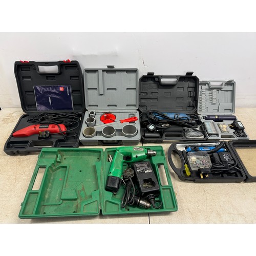 5024A - A quantity of cased tools including a power base 672936 multi-tool with accessories, a Hitachi DTC-1... 