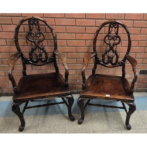 399 - A pair of late 19th Century Chinese carved Hongmu rosewood armchairs