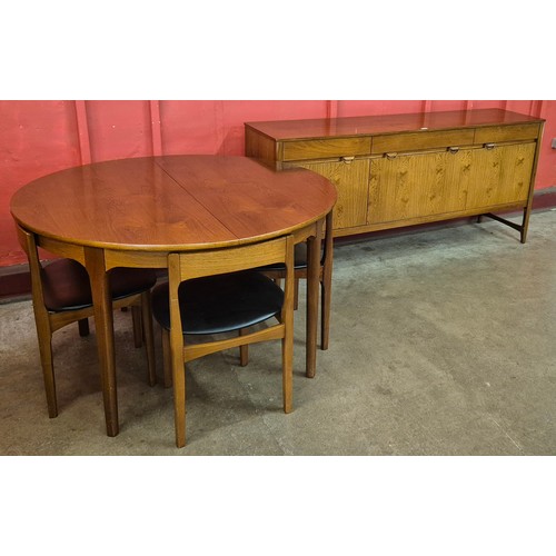 1 - A Nathan Caspian rosewood six piece dining suite, comprising; extending circular dining table, four ... 