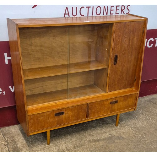 16 - A teak bookcase