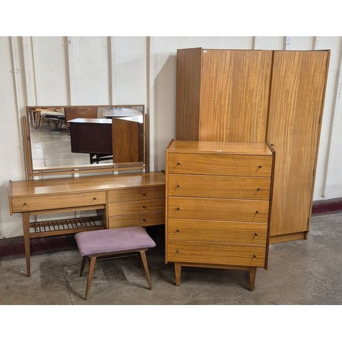 15 - An A. Younger teak bedroom suite, comprising; chest of drawers, wardrobe, dressing table and a stool