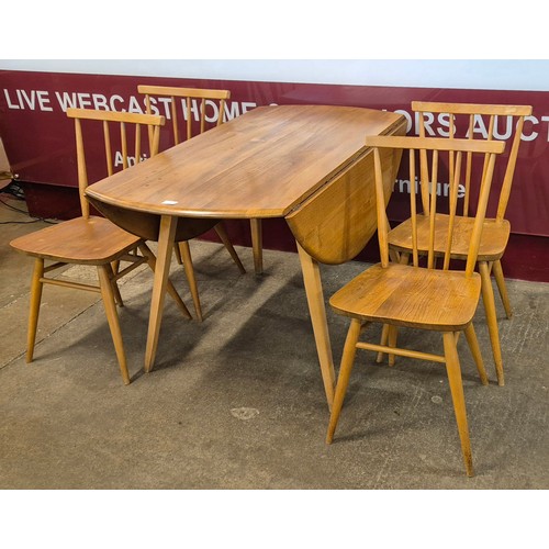 22 - An Ercol Blonde elm and beech Windsor drop-leaf table and four 391 model chairs