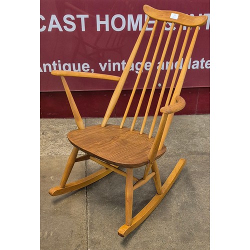 23 - An Ercol Blonde elm and beech Goldsmith rocking chair