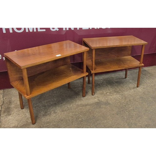 29 - A pair of teak two tier side tables