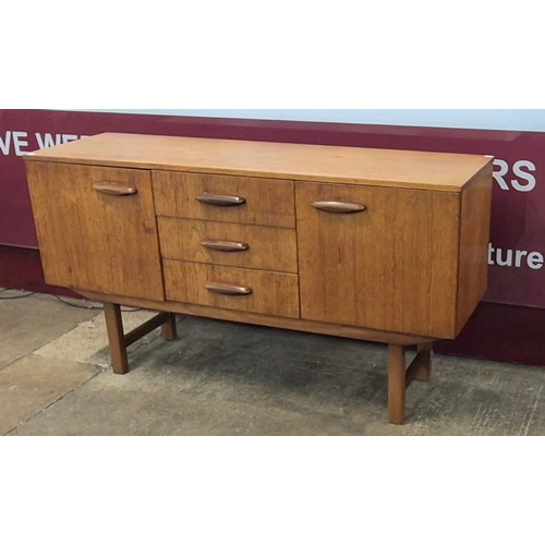 31 - A teak sideboard