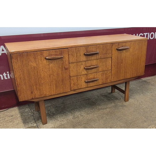 31 - A teak sideboard