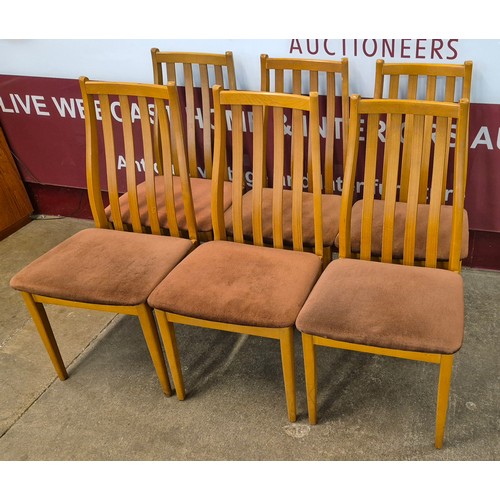 34 - A set of six teak dining chairs