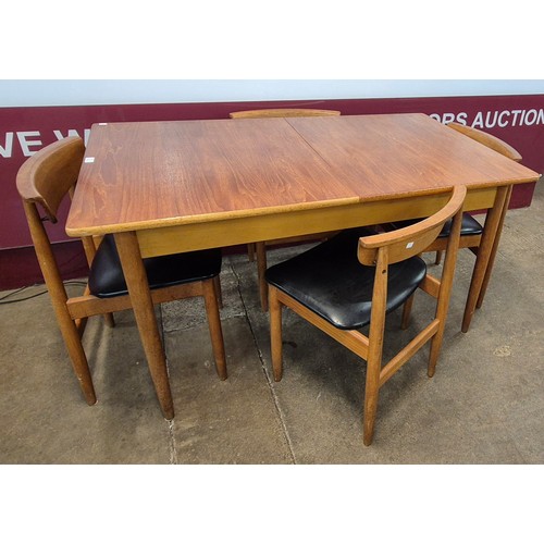 59 - A teak rectangular extending dining table and four chairs