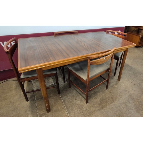 67 - A McIntosh T3 model teak and afromosia extending dining table and four chairs