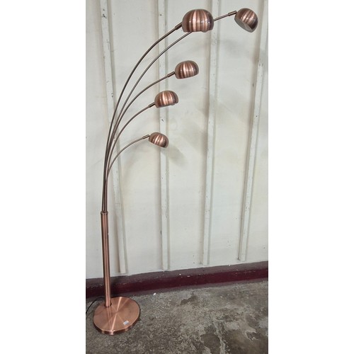 76 - An Italian style copper effect floor standing lamp