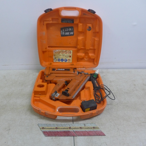 5025 - A Paslode Impulse IM350/90CT nail gun - with battery, charger, a quantity of nails and case