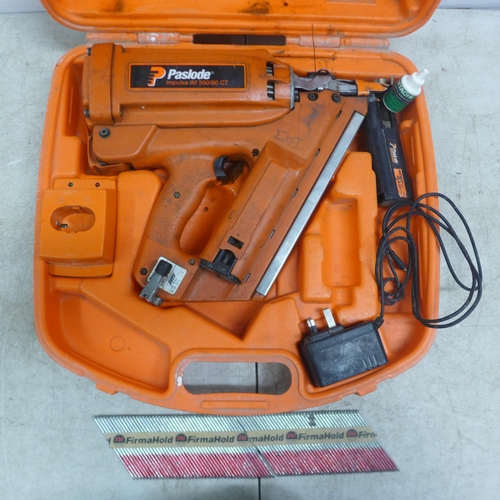 5025 - A Paslode Impulse IM350/90CT nail gun - with battery, charger, a quantity of nails and case