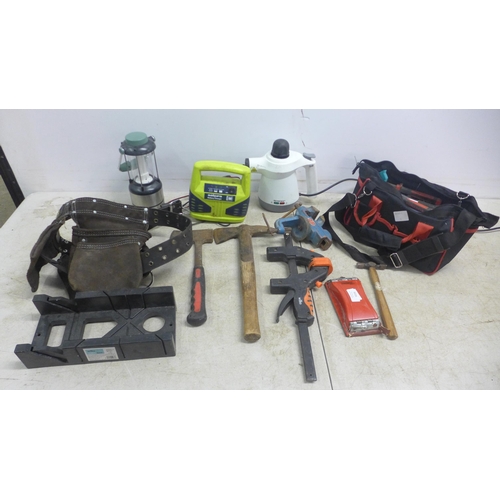 5035 - Two bags of hand tools and other items including a sanding block, SilverCrest steamer, axes, battery... 