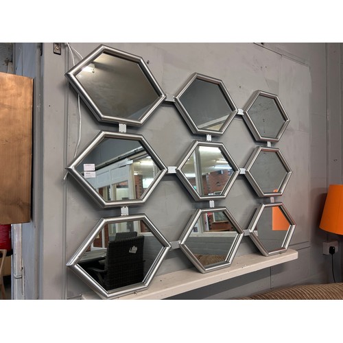 3010 - A silver metal framed mirror, 130cm