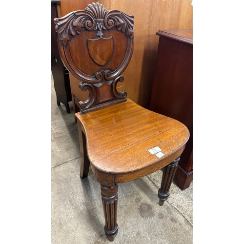 159 - An early Victorian carved mahogany hall chair