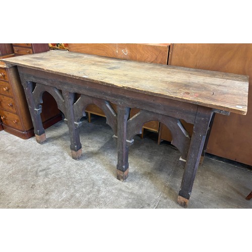 166 - A Victorian Gothic Revival carved pine serving table