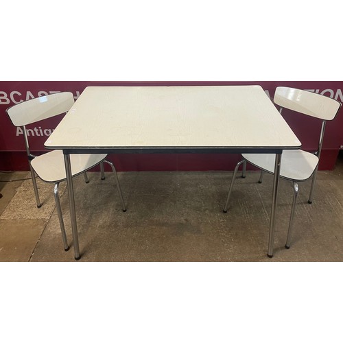 84 - A chrome and Formica topped table and two chairs