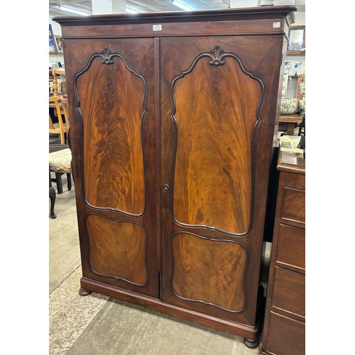 186 - An early Victorian mahogany two door enclosed bookcase