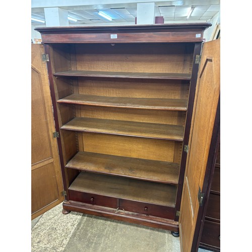 186 - An early Victorian mahogany two door enclosed bookcase